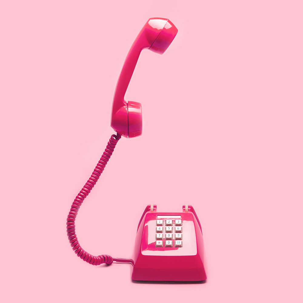 Retro pink telephone on pink background, Pop art or vintage style